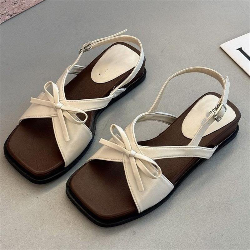 Sandalias de explosión para mujeres 2026 verano nuevo hermoso no cansado zapatillas con falda zapatillas de playa de fondo plano