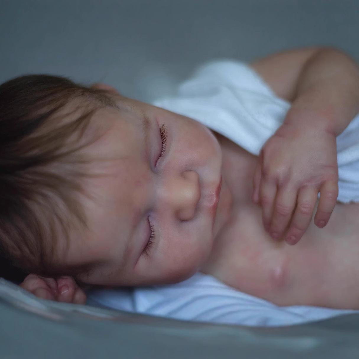 49cm muñeca de simulación de bebé implantado pelo Levi transfronterizo de comercio electrónico azul suministro de mar de una sola pieza de entrega