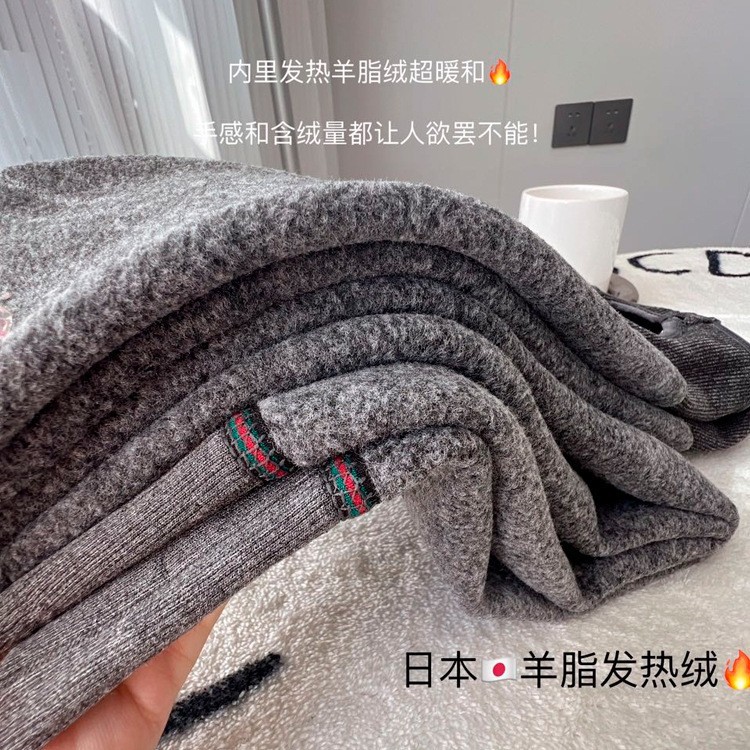 レギンスの靴下の女性は秋冬に厚い綿の縦縞のカシミヤの圧力を加えます。