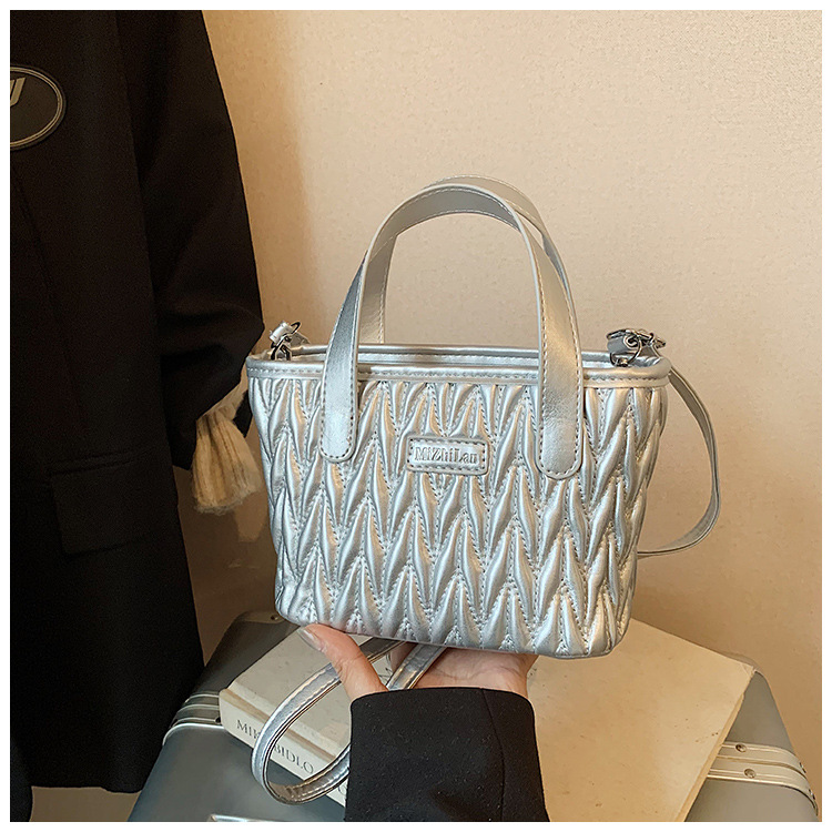 Coreano simple bolso de mano plegable de color sólido bordado de estilo extranjero bolso de hombro para hombres y mujeres nuevos accesorios para niños transfronterizos