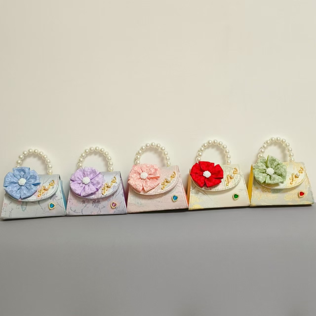 Bolsa infantil nueva niñas bolso de hombro accesorios de ropa china bolso cuadrado princesa bolso de perlas bolso arco bolso de mochila