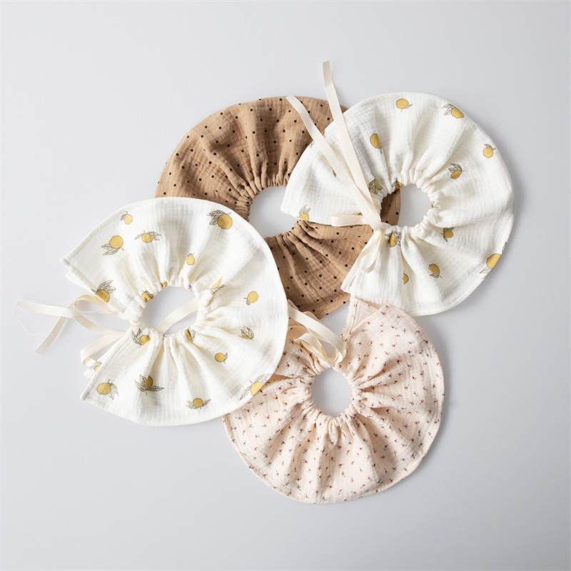 Tipo coreano A 360 grados con cordones babero bebé algodón gasa absorbente ajustable masculino y femenino bebé babero de encaje