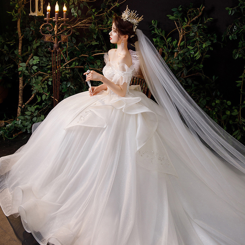 Vestido de novia estilo francés, nueva colección primavera 2026 para novias, vestido principal de hombros descubiertos, estilo princesa de palacio con cola larga, vestido de tul ligero. image 5