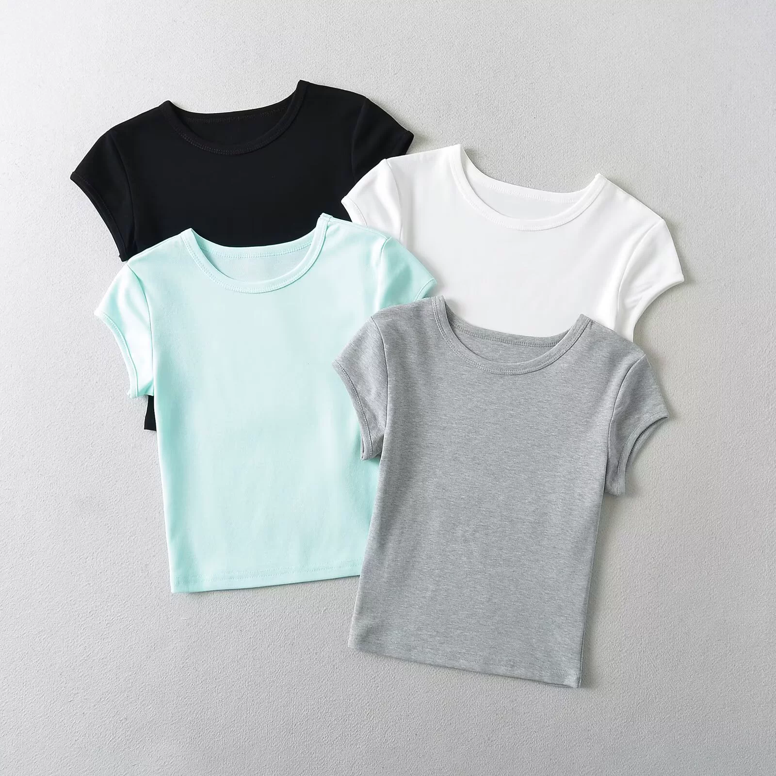 Трансграничная женская одежда оптом, летняя тонкая универсальная футболка с круглым вырезом и короткими рукавами в европейском и американском стиле, базовая эластичная короткая футболка с маленькими летящими рукавами