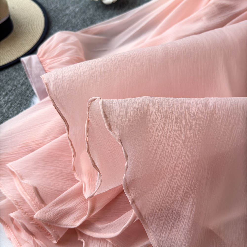 Camicetta elegante da donna con maniche a puff e dettagli floreali_voghion.com