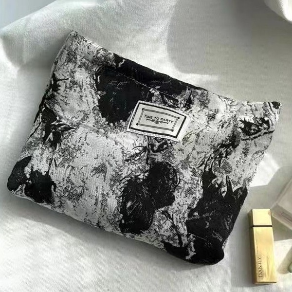 Diseño original de nicho blanco y negro temperamento Jacquard lienzo maquillaje bolsas de mano estilo retro simple flores convenientes