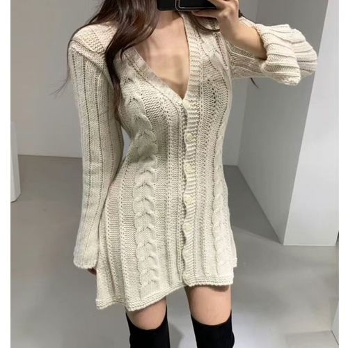 A lightweight, chic Korean-inspired youthful style V-neck linen pattern one-button open front design knit dress with slits at the sleeves