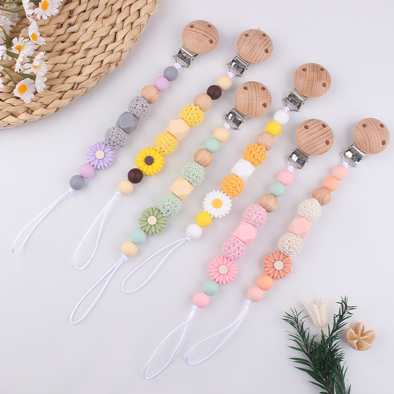 Productos para bebés Clip de chupete de haya Dibujos animados de bebé creativo pequeña margarita pequeña mordedor molar cadena de chupete anti-caída