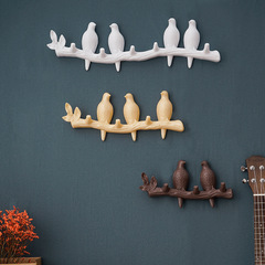 Cute little bird decorative hook behind the Nordic door, seamless wall-mounted coat and hat rack with no-punch required, featuring a row of hooks.