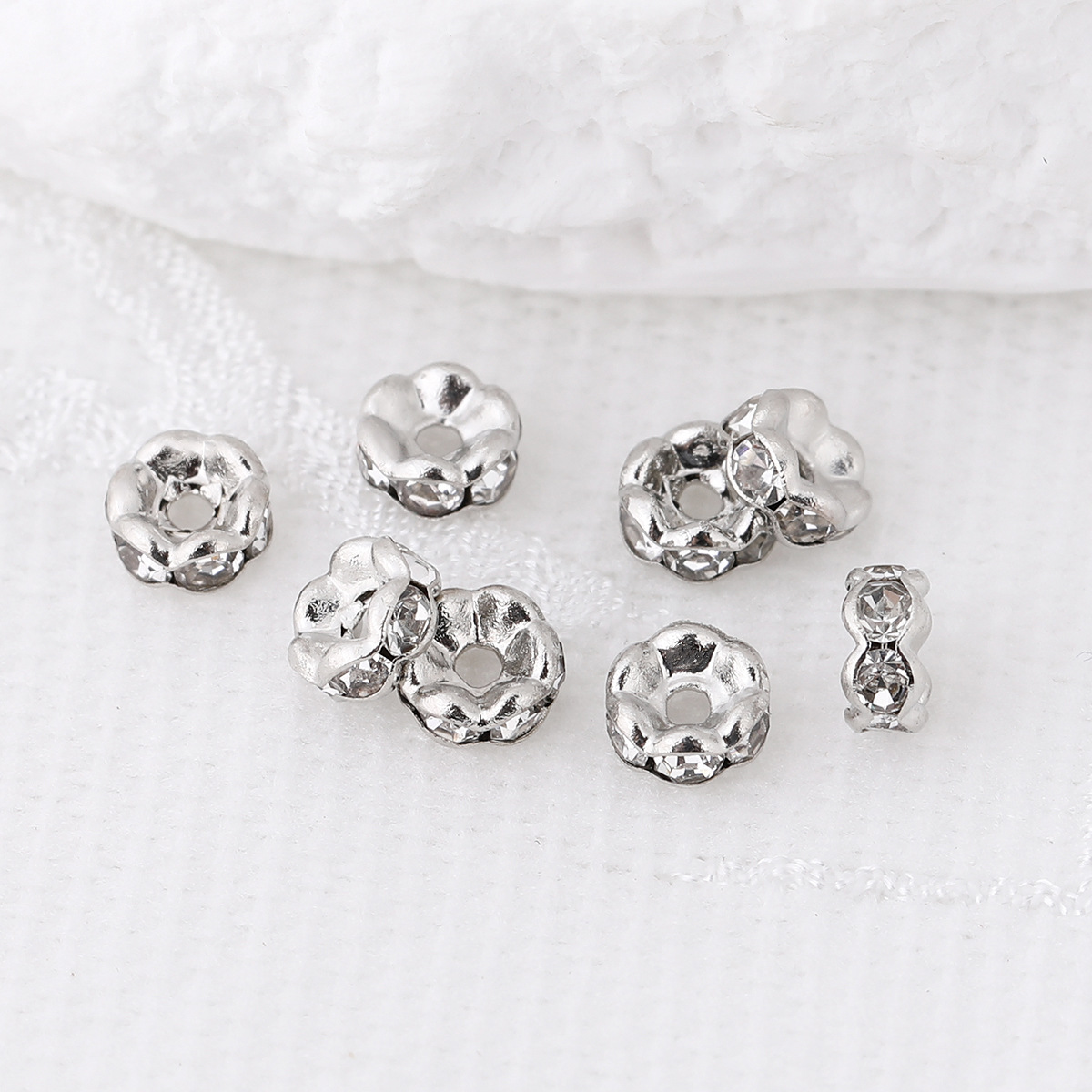 Wavy white K diamond circle