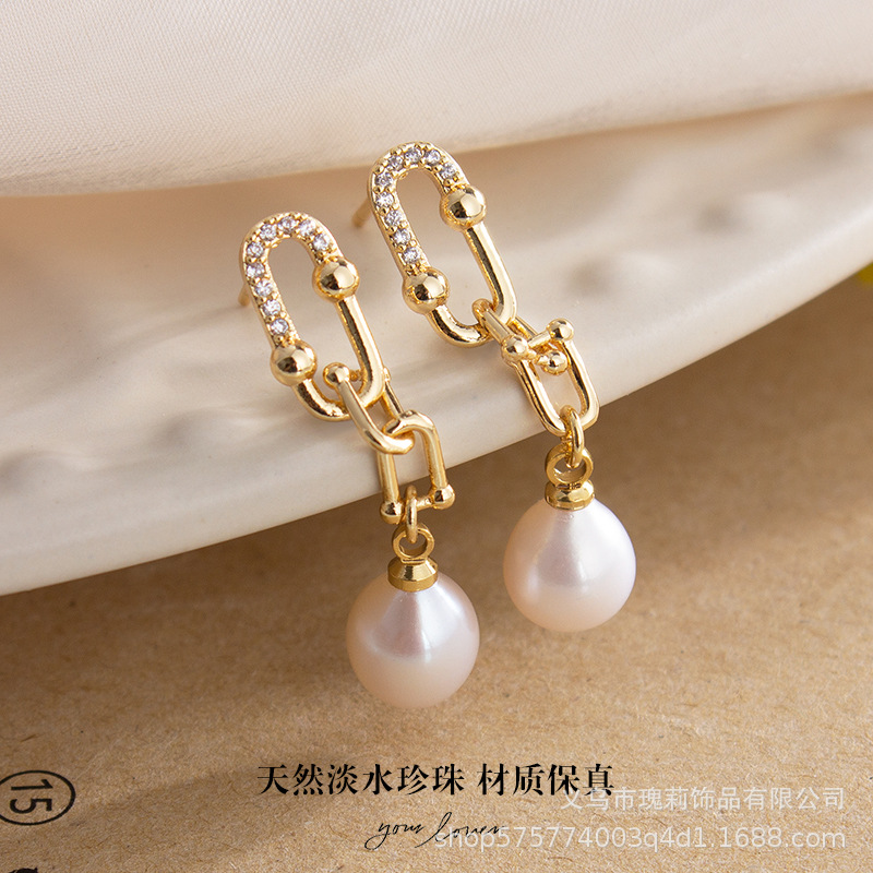 fashionable retro earrings from pearl with tassels