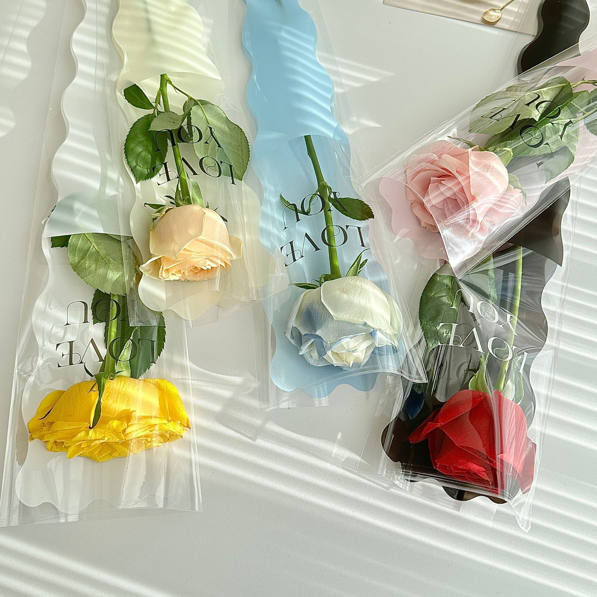 Nueva sirena ondulación del agua sola flor bolsa de embalaje Rosa embalaje OPP escalera bolsa floral material