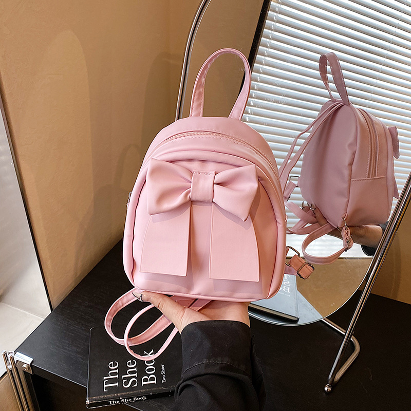Lindo bolso pequeño con lazo simple 2025 verano nuevo estilo diseño sentido mochila pequeña moda estilo occidental mochila salvaje