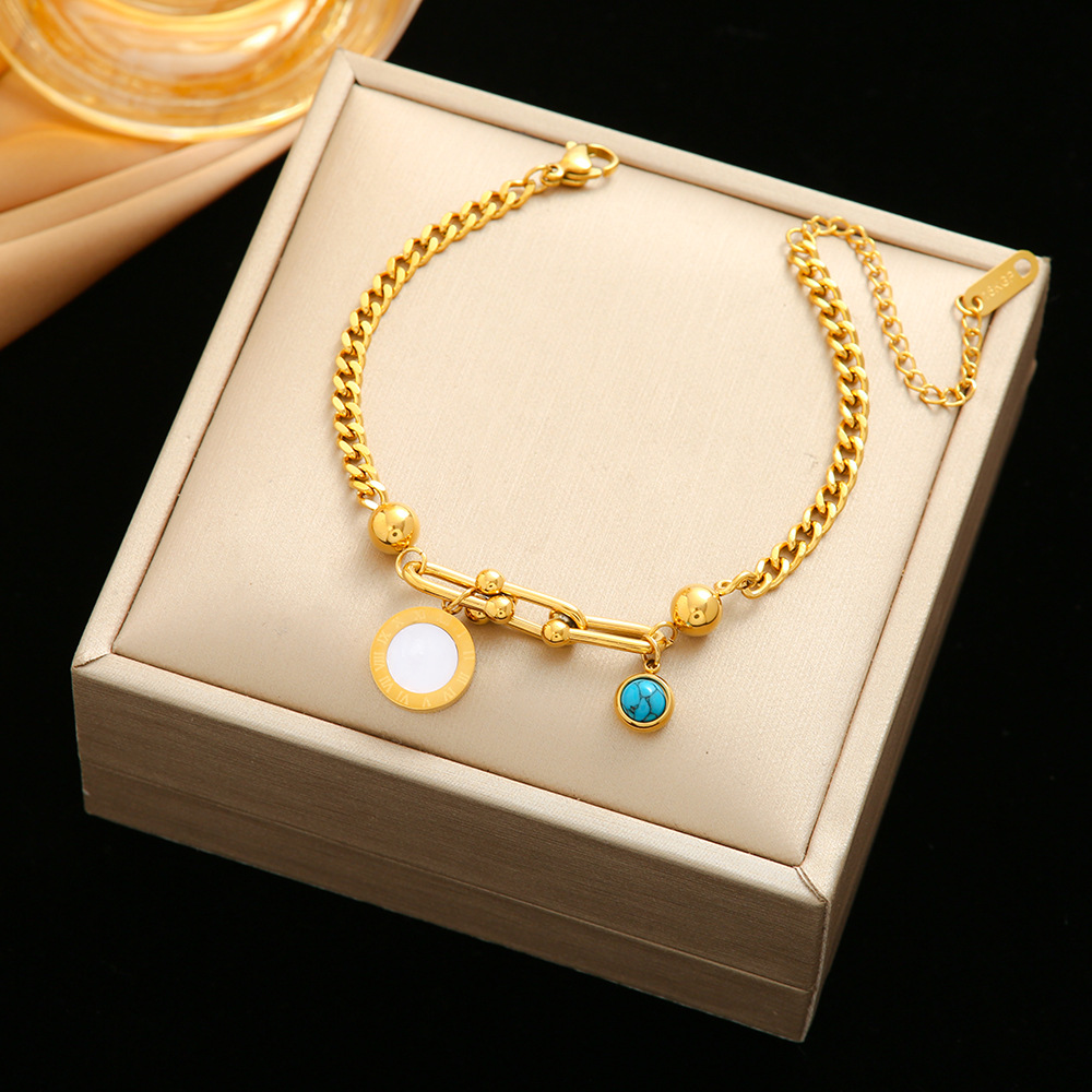 Pulsera de trébol de acero titanium vendedora caliente transfronteriza europea y americana con incrustaciones de concha pulsera colgante pulsera de diseño avanzado sin desvanecimiento al por mayor