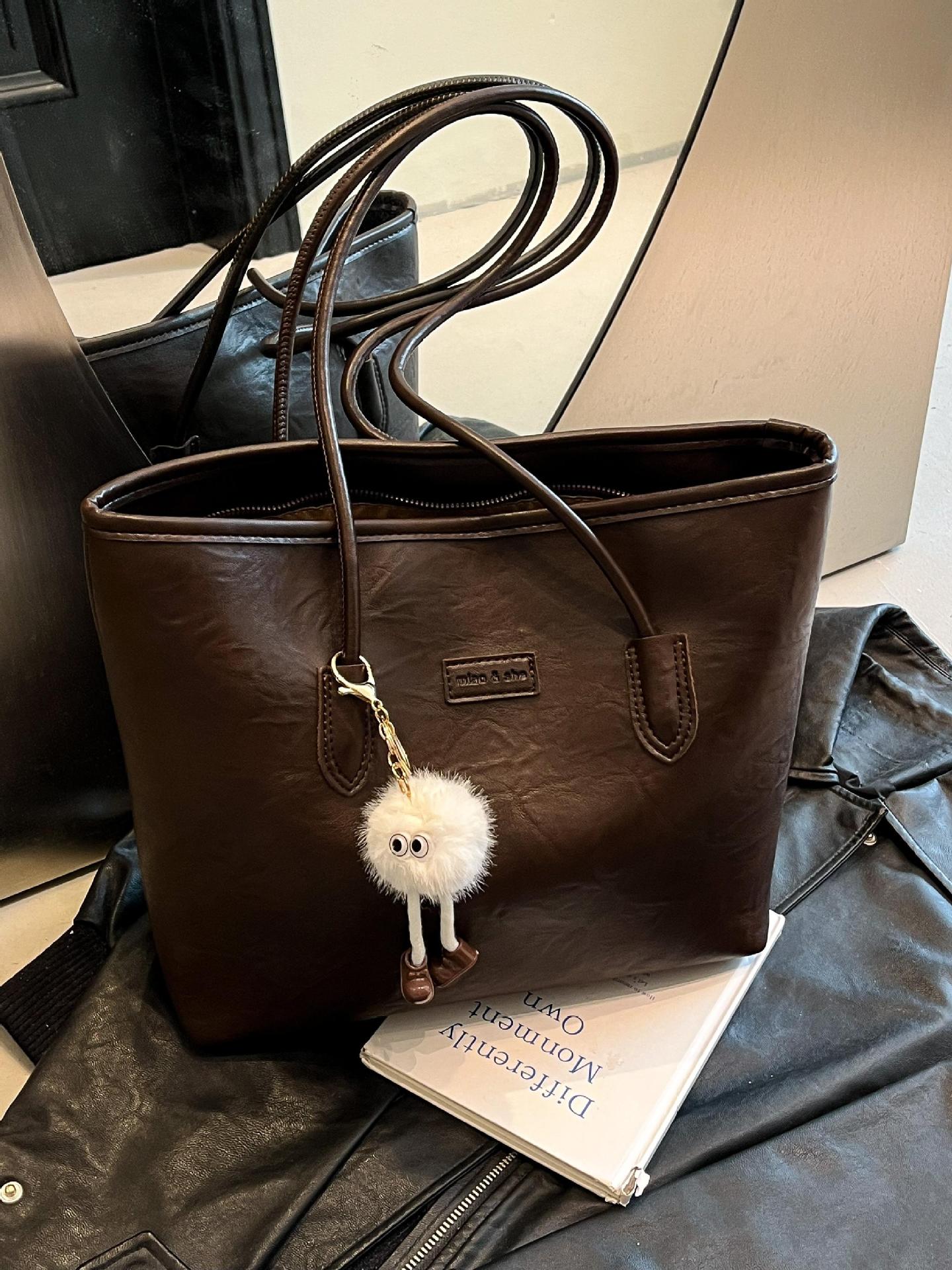 Transfronterizos más vendidos ocio simple bolso de gran capacidad 2025 nuevo producto explosivo bolso de hombro retro bolso de brazo de viaje
