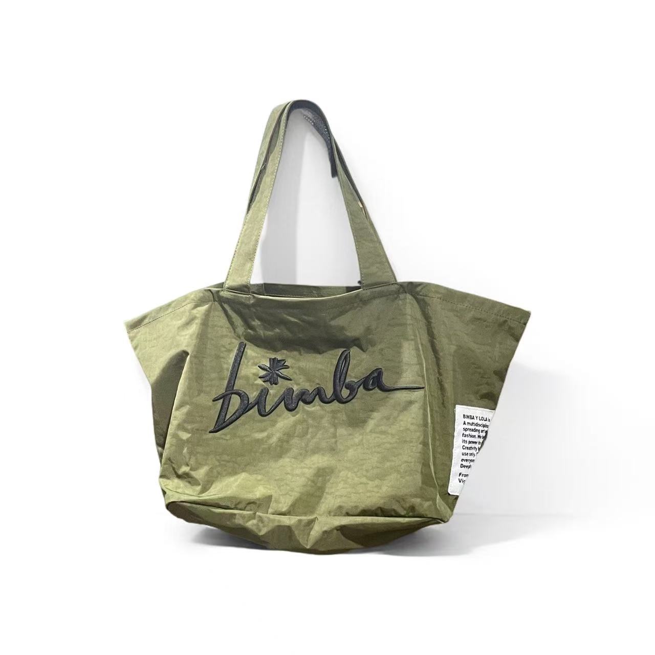 Venta directa de fábrica, bolso de tela español Bimba y Lola, nuevo bolso de mano para mujer de color puro, bolso de mano para mujer, bolso tipo clutch para mujer