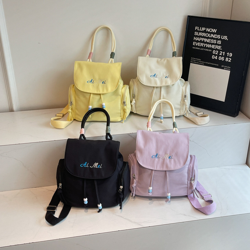 Los estudiantes de tendencia en clase nicho mochila de hombro mujer estilo exterior sensación de diseño de color sólido sensación de moda mochila universal image 5