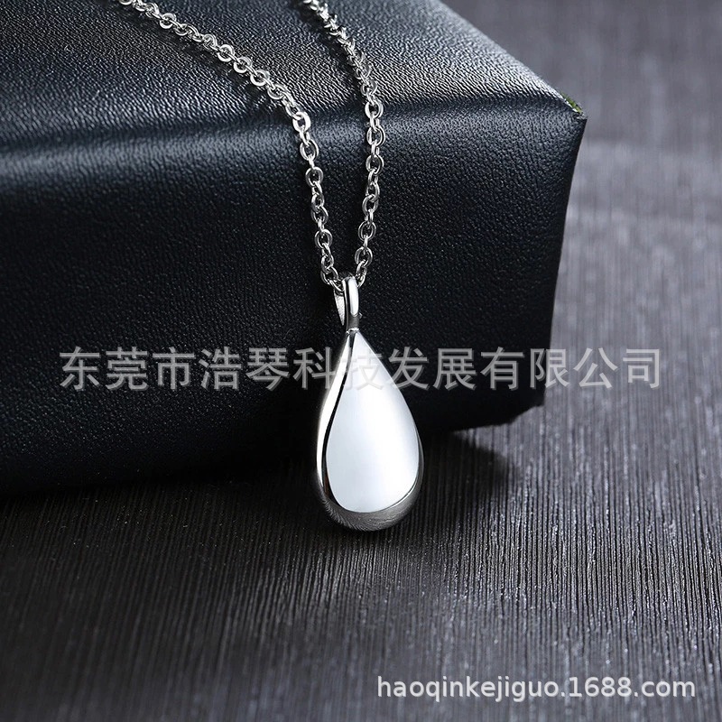 Amazon Venta caliente en forma de gota colgante de cenizas se puede abrir botella de perfume conmemorativa parientes mascota cenizas caja de joyería