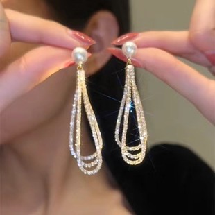Earrings from pearl, diamond encrusted, light luxury style