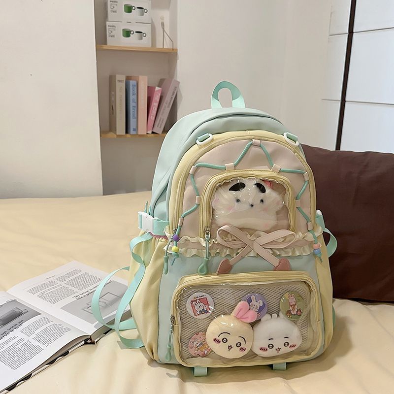 녹색 배낭 (인형 2개 + 뱃지 4개 + 눈썹 별 1개 포함)