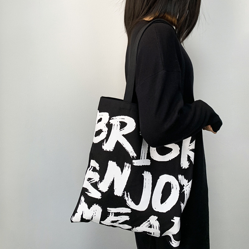 Nuevo bolso de lona de gran capacidad para mujer alfabeto coreano simple y versátil bolso de compras con cremallera bolso de hombro