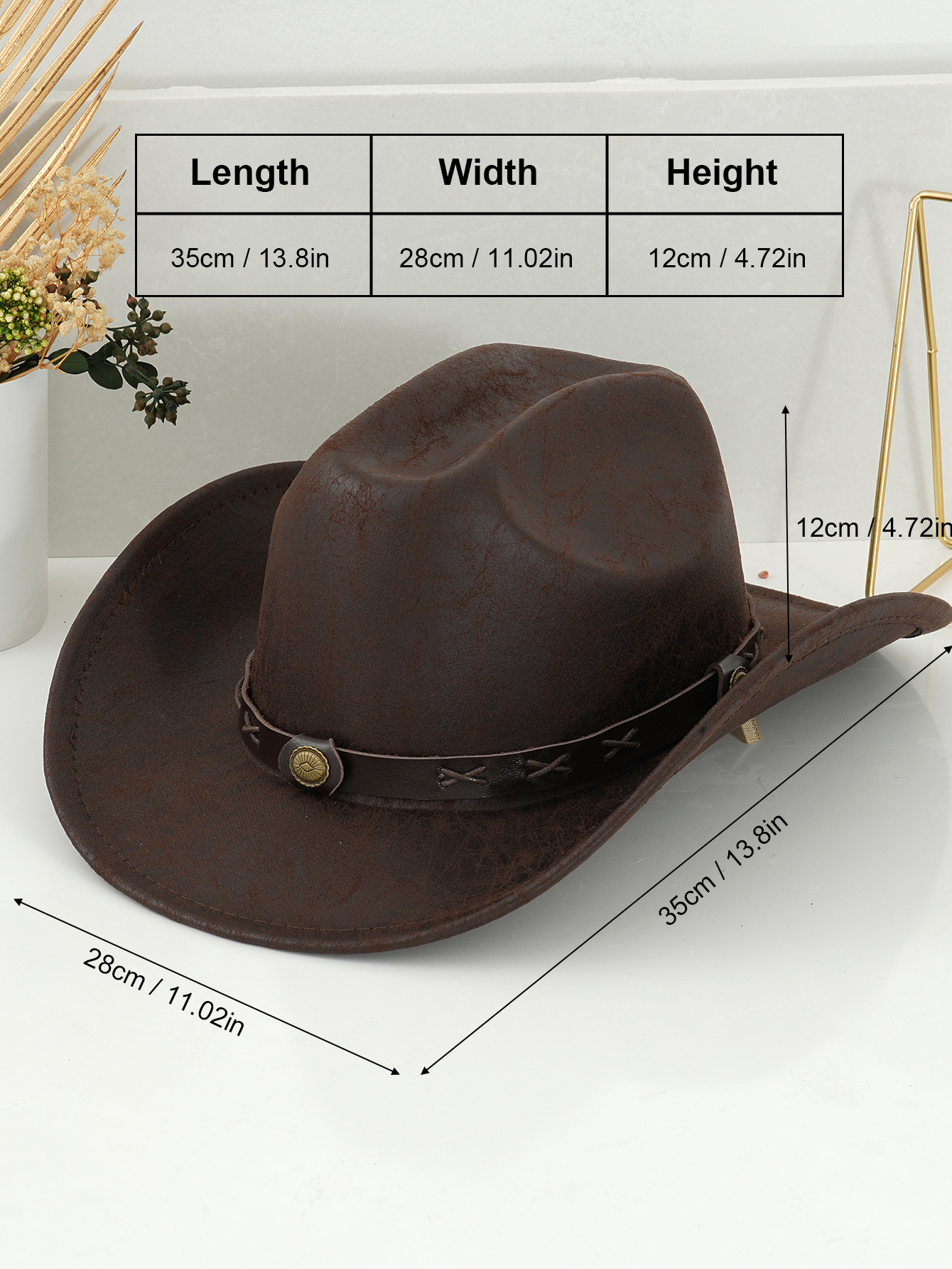 Vintage western cowboyhatt i slitet läder med spänne och mönster_voghion.com