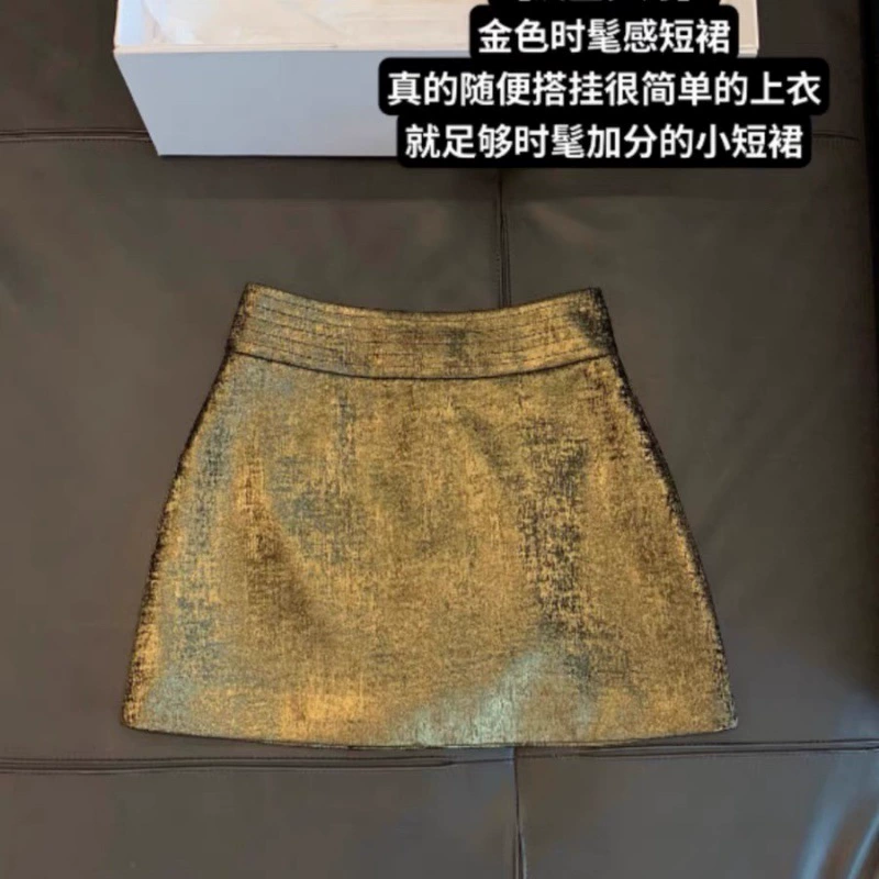 Золото-золотая пряная девушка блестит золотым бюстом юбка 2024 осенняя высокая талия темперамент новая тонкая юбка