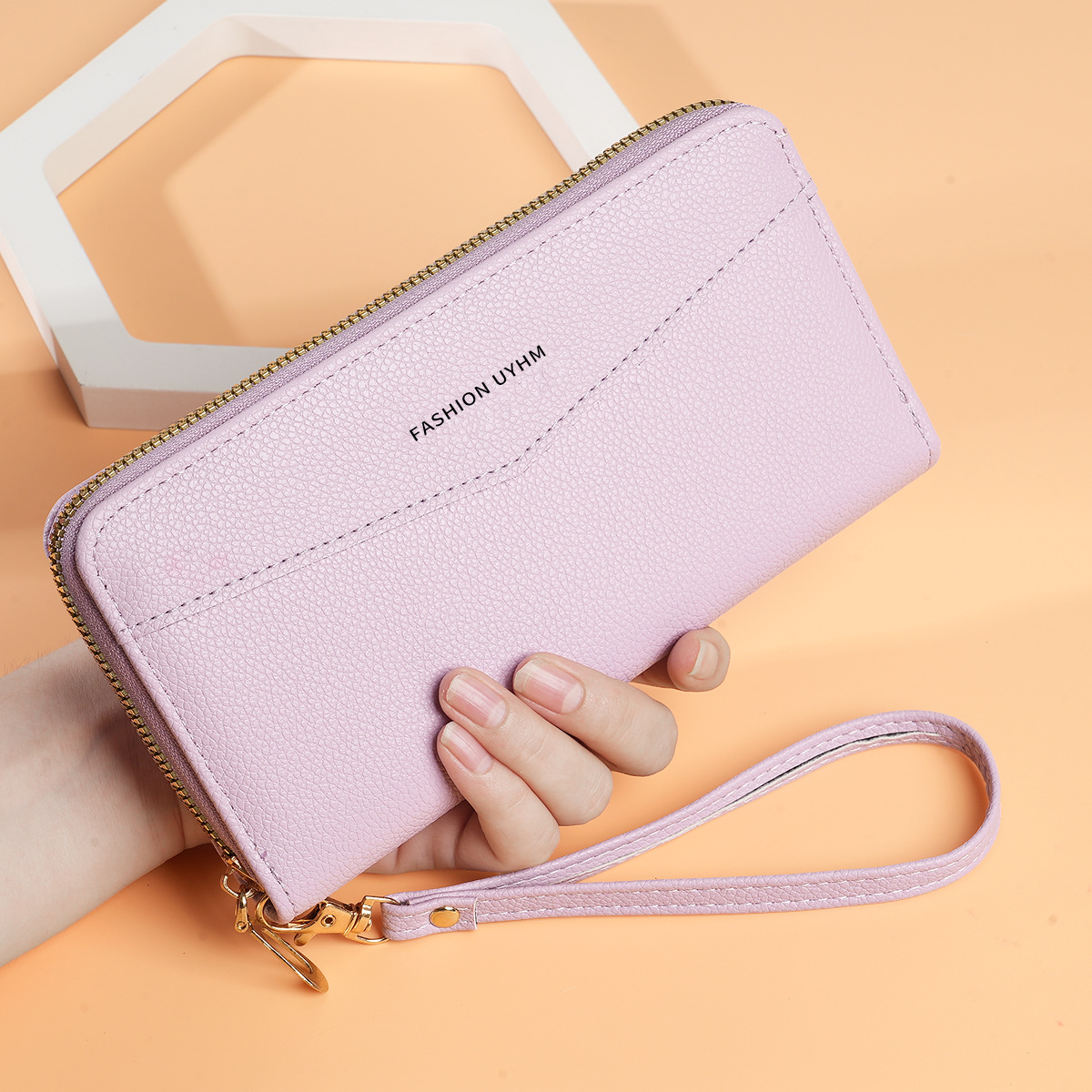 Nuevo bolso de mujer larga Europa y América retro una sola cremallera bolso de mano gran capacidad cambio bolso de teléfono móvil correa de muñeca práctica