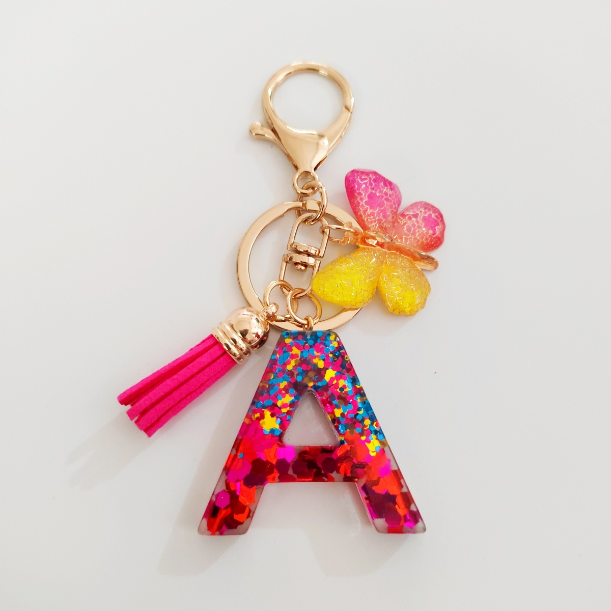 Ventas transfronterizas calientes de letras inglesas de color mixto colgante de llavero colgante de mariposa fringe de resina de llavero colgante de joyería