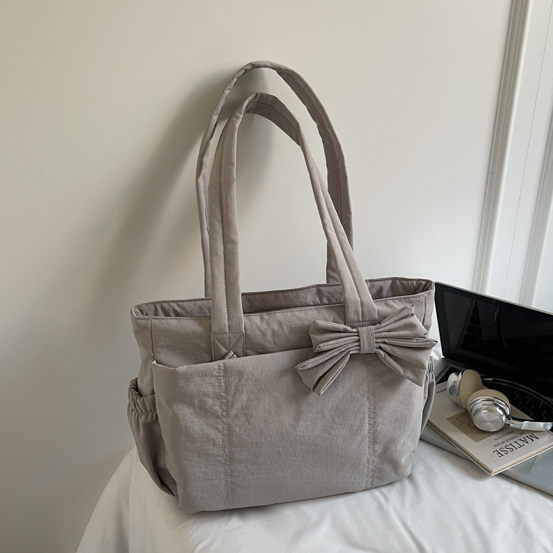 Bolso de lazo retro simple y ligero de color sólido bolso especial de costura de coche de moda femenino bolso de ropa de algodón de textura de hombro único bolso de moda