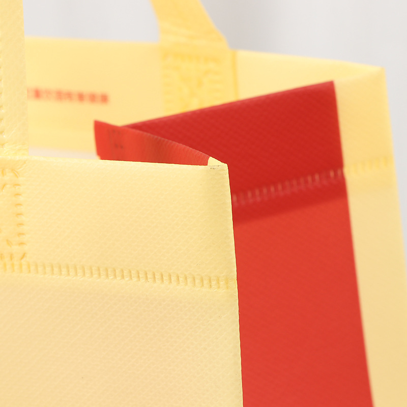 Bolsa de mano de película de espesamiento estampado en oro embalaje de vino no tejido bolsas de regalo UV color impresión de productos de salud bolsa de compras al por mayor