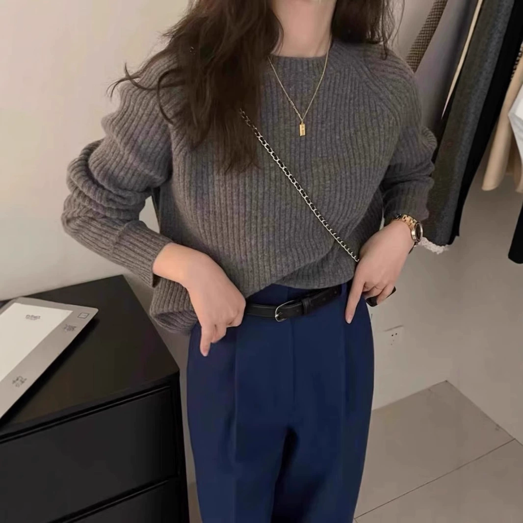 Solid demi-season woolen knitted short sweater with a round collar