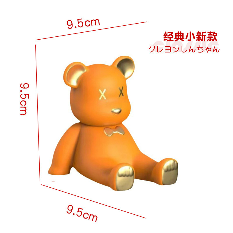 アニメのクレヨンの小さい新しい携帯電話のタブレットのスタンドの子供の頃の怠け者のネットの赤いアニメの手は湿ってかわいい子供の置物を遊びます。|undefined