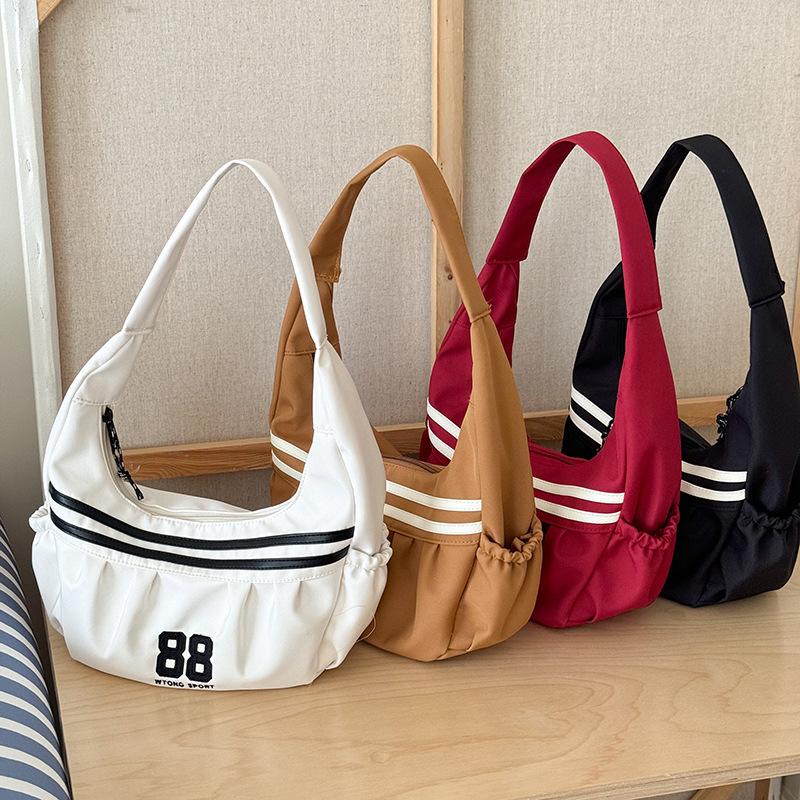 Versión coreana del bolso de hombro para niños y niñas de moda, bolso de mensajero para niños de gran capacidad digital de estilo occidental, bolso de niños a rayas de moda