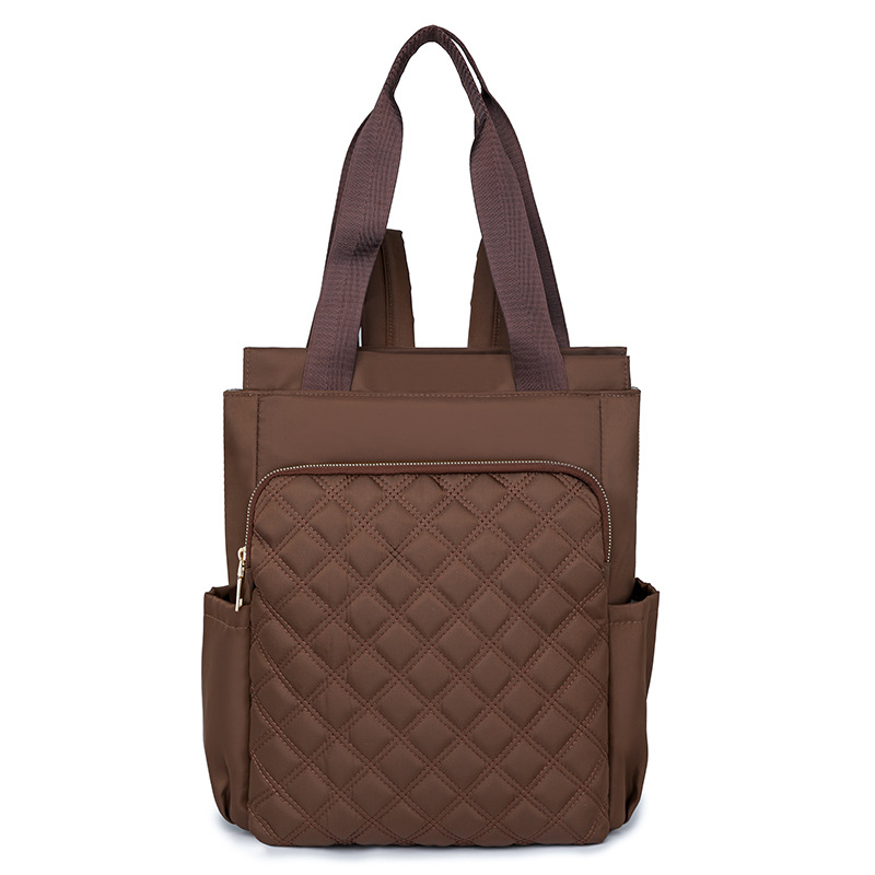 Mochila de mujer salvaje de color puro 2024 nueva mochila portátil de moda, bolso de viaje ligero y de gran capacidad