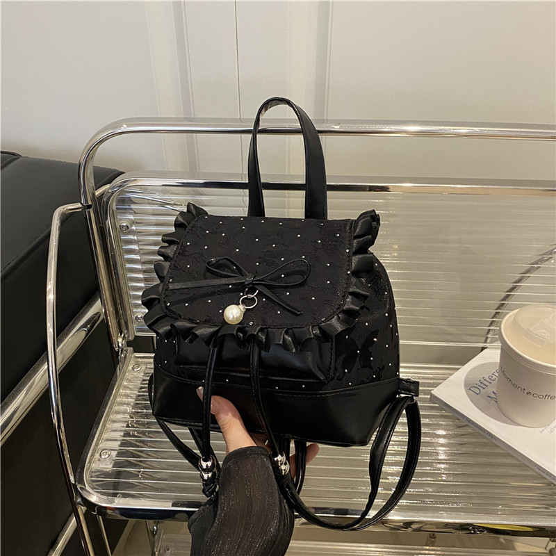 Bolsa de mano de moda coreana de chicas 2025 nuevo encaje de alto valor de la cara, mochila de hombro versátil