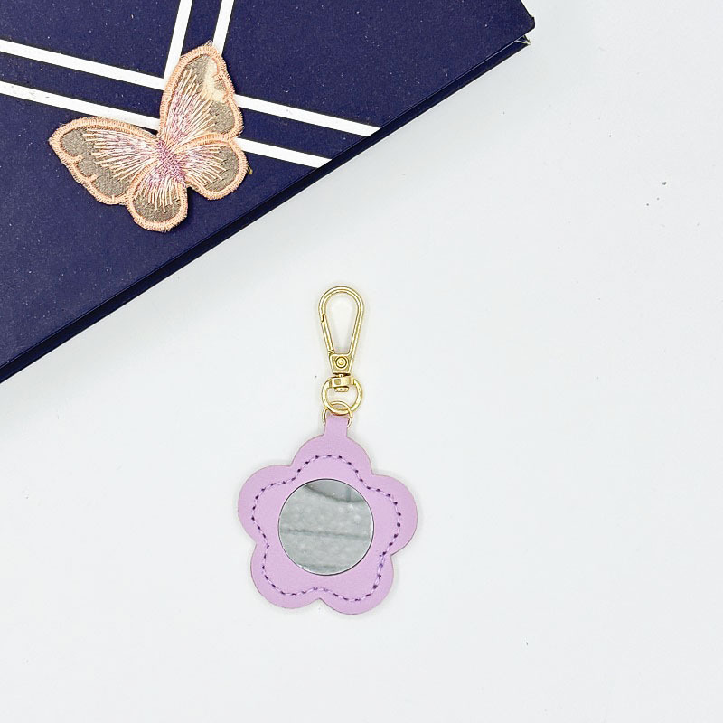 Flor espejo llavero cuero transfronterizo regalo colgante joyería creativo mini lápiz labial almacenamiento llavero colgante
