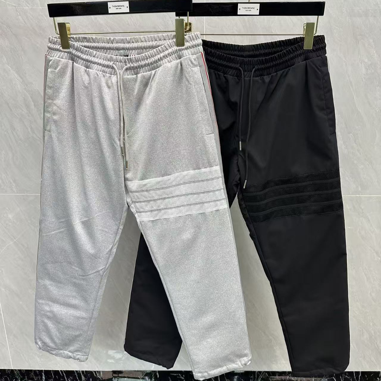Factory direct sales of popular four-stripe down pants from Taobao, casual, versatile, simple unisex down trousers, straight leg.