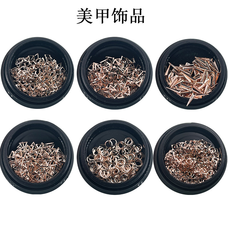 Golden accessory for manicure contains rose