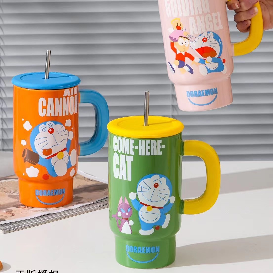 Nuevos productos creativos Dingdong gato taza de cerámica con cubierta taza de agua de paja taza de café Doraemon taza de oficina de alto valor
