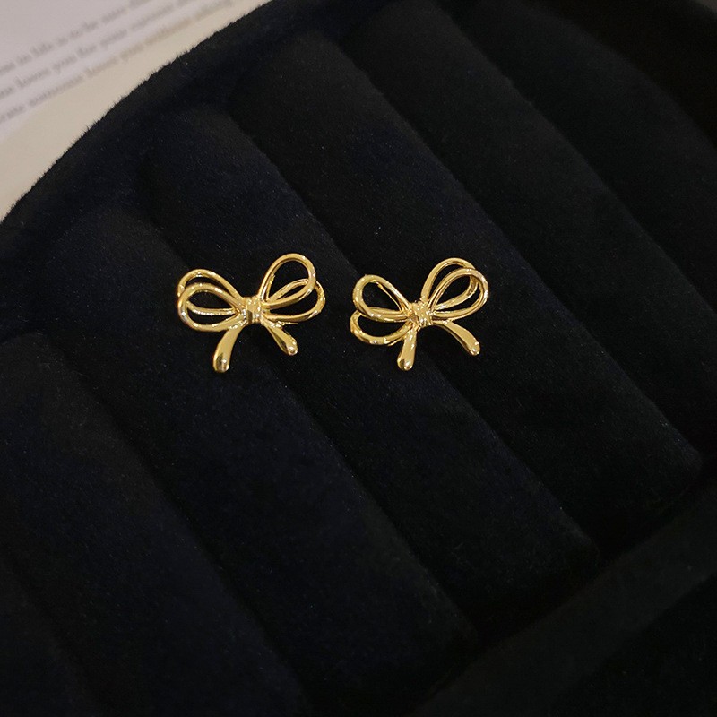 Aguja de plata Pendientes de lazo de diamantes coreanos Pendientes de temperamento de moda de todo fósforo Pendientes de diseño de nicho Sentido de lujo ligero