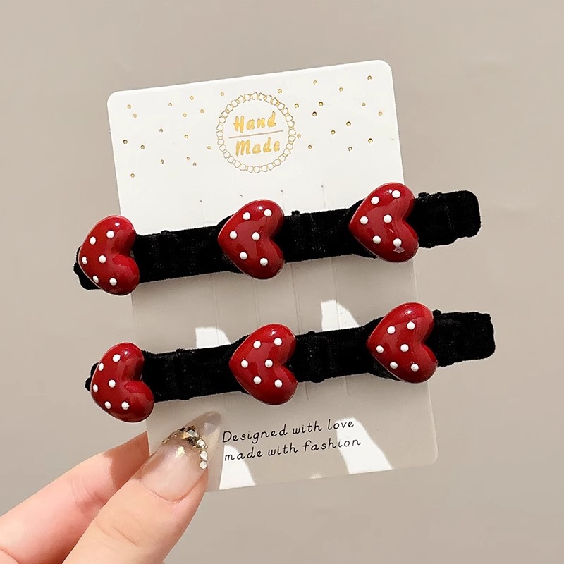 Niños de Año Nuevo acabado de cabello roto artefacto de otoño y invierno flocado rojo amor trenzado clip de cabello para mujeres flanqueado clip