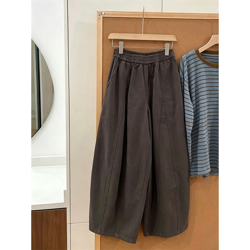 Loose-fitting, flowing wide-leg pants with an elastic waistband, high-waisted design, slimming effect, and hip-covering style, versatile for casual and relaxed looks, balloon pants