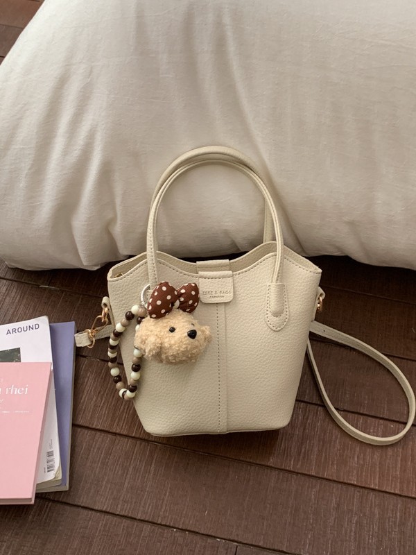 Bolso de mano de moda retro 2026 nuevo temperamento simple bolso de cubo de viaje ocio mochila de hombro