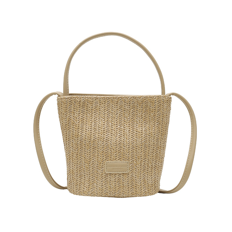 Bolso de cubo de vacaciones junto al mar 2025 nuevo bolso de mujer bolso de hombro tejido de paja de playa bolso de mensajero de color de contraste a rayas