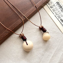 民族风平安扣百搭饰品毛衣链挂坠简约文艺菩提根复古款象牙果项链