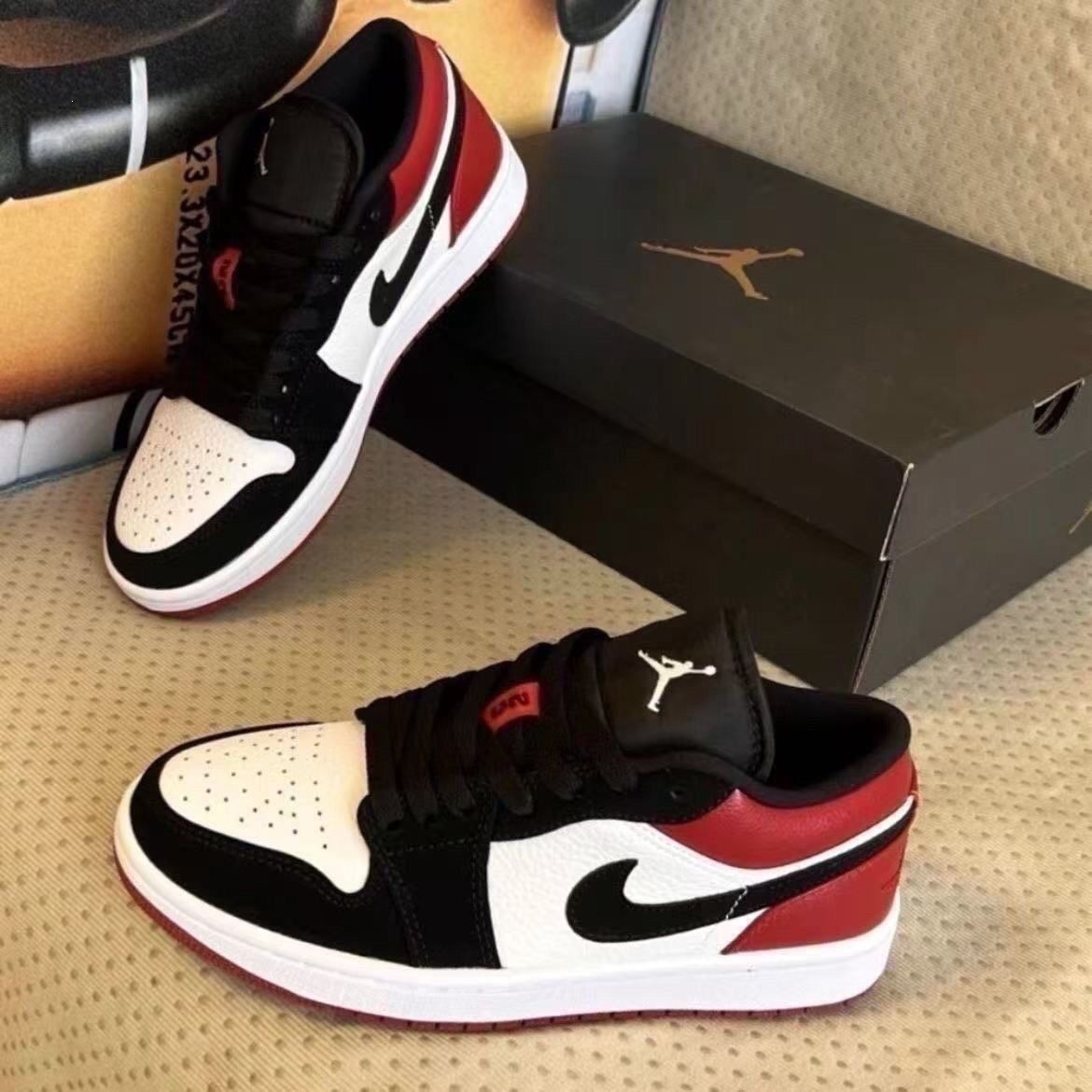 Chunyuan AJ1 Meituan negro, blanco y amarillo campus de moda baja pareja de hombres y mujeres zapatos de skate casuales