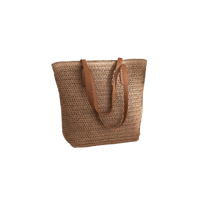 Bolsa de paja estilo de vacaciones bolsa tejida de verano modelo femenino 2025 de gran capacidad para ir al trabajo y a la escuela bolsa de viaje al por mayor