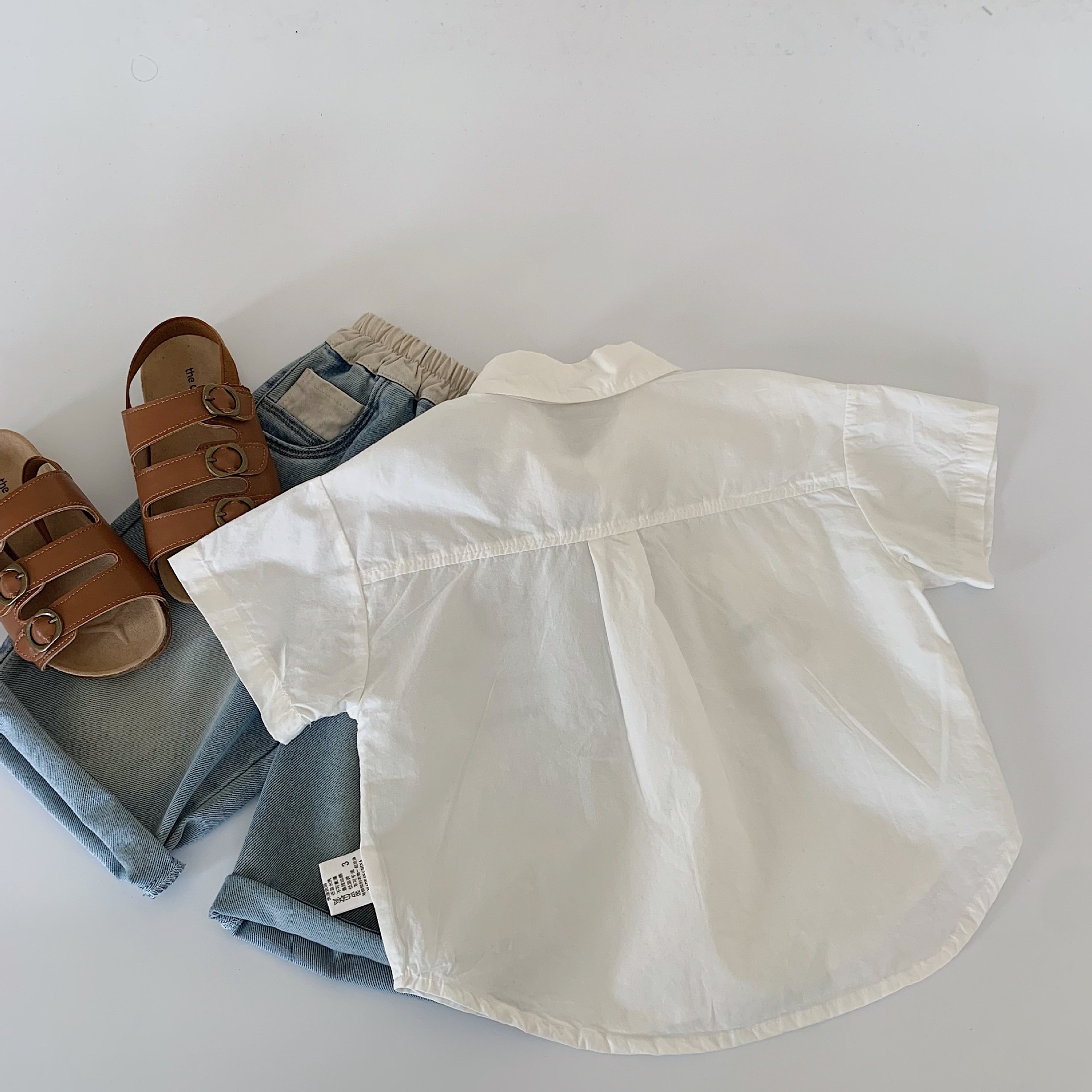 Camisa para niños Maibao 2025 verano nuevo estilo coreano niños y niñas dibujos animados camisa de manga corta ropa de verano para bebés al por mayor