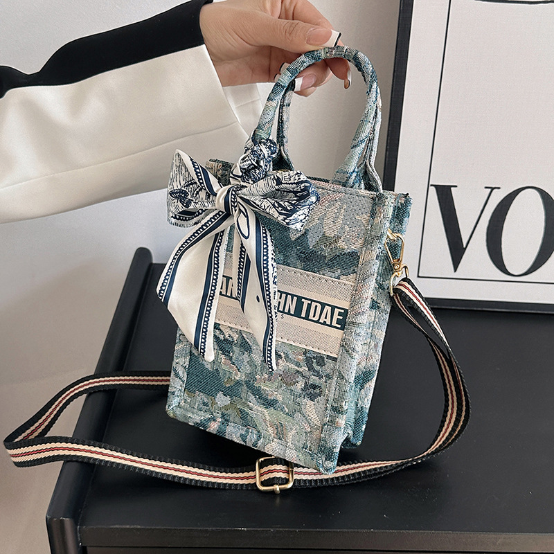 Bolso pequeño para mujer, nuevo bolso de mano vertical personalizado de moda europea y americana, bolso cruzado con estampado de lona de nicho